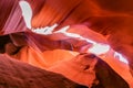 Scenery of bright sun rays falling inside Antelope Canyon and illuminating him. Surface of the rocks in the cave reflects the sun. Royalty Free Stock Photo