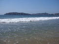 Scenery of calm beach at bay of ACAPULCO city in Mexico and white waves of Pacific Ocean landscape Royalty Free Stock Photo