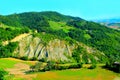 Scenery from Castignano with a hill of ravines and green colours, a valley and the Sibillini Royalty Free Stock Photo