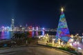 Christmas tree and decoration with skyline of Victoria harbor of Hong Kong city