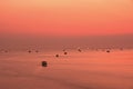 Scenery colorful sky and seascape with silhouette hut over sea before sunrise.