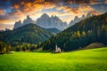 Scenery of Dolomites with the St. John's in Ranui Chapel, Santa Maddalena at sunset. Italy Royalty Free Stock Photo