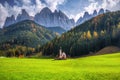 Scenery of Dolomites with the St. Johns in Ranui Chapel & x28;La Chiesetta di San Giovanni in Ranui& x29;, Santa Maddalena. Italy