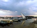 Scenery of an empty beach with moored boats at sunset Royalty Free Stock Photo