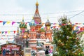 Scenery of the festive Red Square in winter Moscow. Christmas decorations near the Moscow Kremlin during snowfall. New Year fair Royalty Free Stock Photo