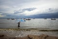 Scenery of a fishing boat in the sea and a cloudy sky in the background at Bangsaen in Chonburi Province