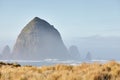 Scenery of the Haystack Rock in the morning fog at Cannon Beach, Oregon Royalty Free Stock Photo