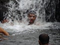 A holiday bath under a waterfall