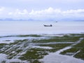 The scenery of the island and the calm sea.