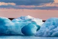 Scenery of Jokulsarlon glacier lagoon with blue iceberg melting and sunset sky on summer Royalty Free Stock Photo