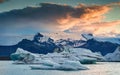 Scenery of Jokulsarlon glacier lagoon with blue iceberg melting and sunset sky on summer Royalty Free Stock Photo