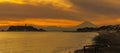 Scenery Kamakura Yuigahama Beach with Kamakura city and Fujisan mountain. Twilight silhouette Mount Fuji behind Enoshima island at Royalty Free Stock Photo