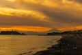 Scenery Kamakura Yuigahama Beach with Kamakura city and Fujisan mountain. Twilight silhouette Mount Fuji behind Enoshima island at Royalty Free Stock Photo