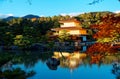 Scenery of Kinkaku-ji, a famous Zen Buddhist temple in Kyoto Japan, with view of Golden Pavilion glittering under blue clear sky Royalty Free Stock Photo