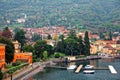 Scenery of Lenno in Lombardy Italy, a lakeside town by Lago di Como with view of ferry boats parking by the dock Royalty Free Stock Photo