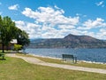Scenery Okanagan lake overview with the bench at the waterfront Royalty Free Stock Photo