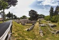 Scenery panoramic view in the excavation ruins at Ostia Antica with the beautiful mediterranean vegetation among the remains of Royalty Free Stock Photo