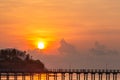 Scenery of rawai pier with sky sunrise, Phuket, Thailand. This place is an amazing sunrise spot. Harbor bridge. Sea level lower.