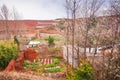 Scenery rural south Yunnan, China, vegetable garden and straw puppet on the Red Land of Dongchuan. Beautiful old village and trees Royalty Free Stock Photo