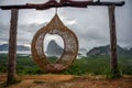 The scenery of the Sametnangshe island looks through the hanging basket wicker chair in Phang-nga province, Thailand