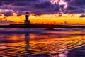 The scenery of the silhouette of Khao Lak Light Beacon in sunset time with the dramatic twilight sky at Nang Thong Beach, Phang