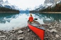 Scenery of Spirit Island with female traveler on kayak by the Maligne Lake in the morning at Jasper national park Royalty Free Stock Photo