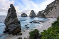 Scenery of sunny day with sand beach, turquoise ocean and mountains. View of Diamond beach, Nusa Penida, Bali island, Indonesia.