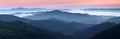 Scenery of the sunrise at the high mountains. Dense fog with beautiful light. A place to relax in the Carpathian Park. Hoverla.