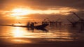 Scenery of sunrise over lake with thai traditional fishing trap at Pakpra Royalty Free Stock Photo