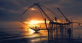 Scenery of sunrise over lake with thai traditional fishing trap at Pakpra Royalty Free Stock Photo