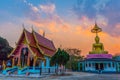 Scenery sunset behind the golden buddha in Chiang Rai