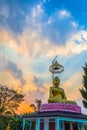 Scenery sunset behind the golden buddha in Chiang Rai Royalty Free Stock Photo