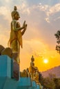 Scenery sunset behind the golden buddha in Chiang Rai Royalty Free Stock Photo