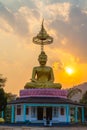 Scenery sunset behind the golden buddha in Chiang Rai Royalty Free Stock Photo