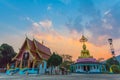 Scenery sunset behind the golden buddha in Chiang Rai Royalty Free Stock Photo