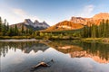 Scenery of Three sisters mountain reflection on pond at sunrise in autumn at Banff national park Royalty Free Stock Photo