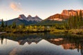 Scenery of Three sisters mountains reflection on pond at sunrise in autumn at Banff national park Royalty Free Stock Photo