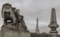 Scenery view of The Eiffel Tower at evening seen from the Pont Alexandre-III bridge with Statue of Lion & child sculpture in the Royalty Free Stock Photo