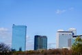 Scenery view of glass and office building on blue sky background. Royalty Free Stock Photo