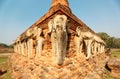 Scenery of Wat Sorasak, an ancient Buddhist Temple with elephant sculptures supporting the base of the stupa Royalty Free Stock Photo