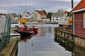 Scenery with wooden houses and boats in Haugesund, Norway. Royalty Free Stock Photo