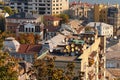 Scenic aerial landscape view of the roofs of buildings. Roof with funny decorated satellite antennas.