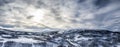 Scenic aerial panorama view on Scandinavian Mountains close to Joesjo lake in Swedish Lapland in winter cover, Sun behind clouds, Royalty Free Stock Photo
