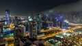 Scenic aerial view of a big modern city at night timelapse. Business bay, Dubai, United Arab Emirates. Royalty Free Stock Photo