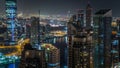 Scenic aerial view of a big modern city at night timelapse. Business bay, Dubai, United Arab Emirates. Royalty Free Stock Photo