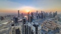 Scenic aerial view of a big modern city with sunset timelapse. Business bay, Dubai, United Arab Emirates. Royalty Free Stock Photo
