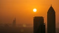 Scenic aerial view of a big modern city with sunset timelapse. Business bay, Dubai, United Arab Emirates. Royalty Free Stock Photo