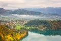 Scenic aerial view of Bled in Julian Alps at sunset, Slovenia. Amazing autumn landscape with emerald lake and sunny alpine valley Royalty Free Stock Photo