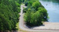 Scenic Aerial View Overlooking A Curvy Road And Beautiful Blue River