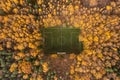 aerial view of small football field among colorful fall trees